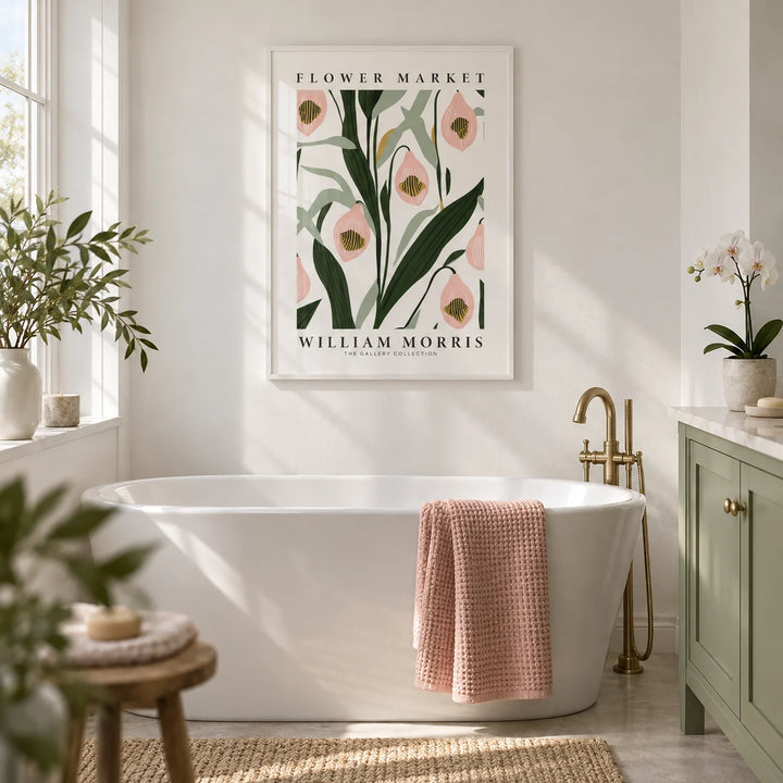 Paintings of Orchids, framed on the wall of a calm bathroom with plain white walls and a plain sage green painted vanity