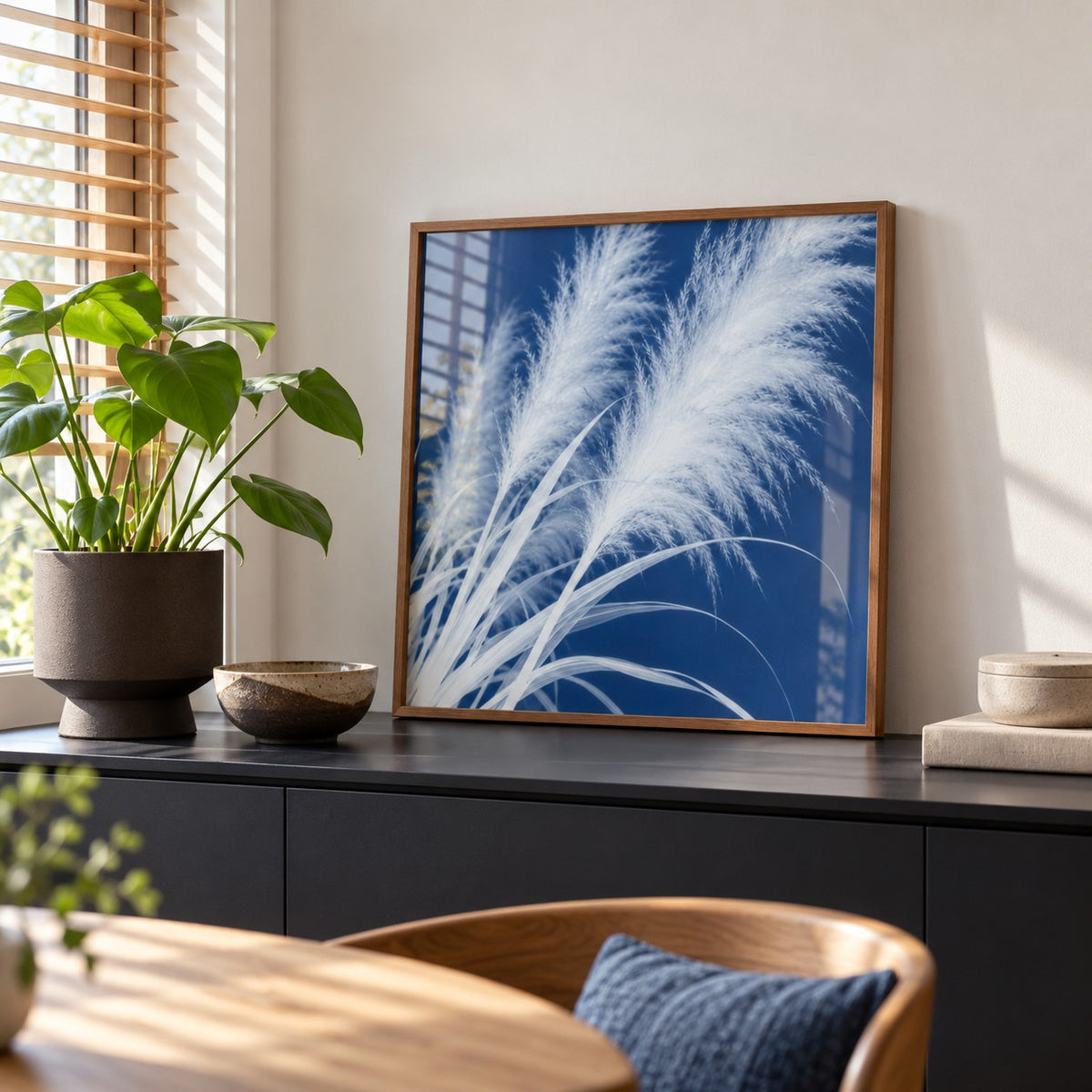 Pampas Grass Cyanotype Print styled on a black sideboard (frame not included)