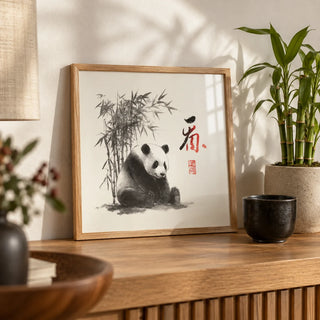 Panda Art Print, a small A4 framed print leaning on an oak shelf in a living room