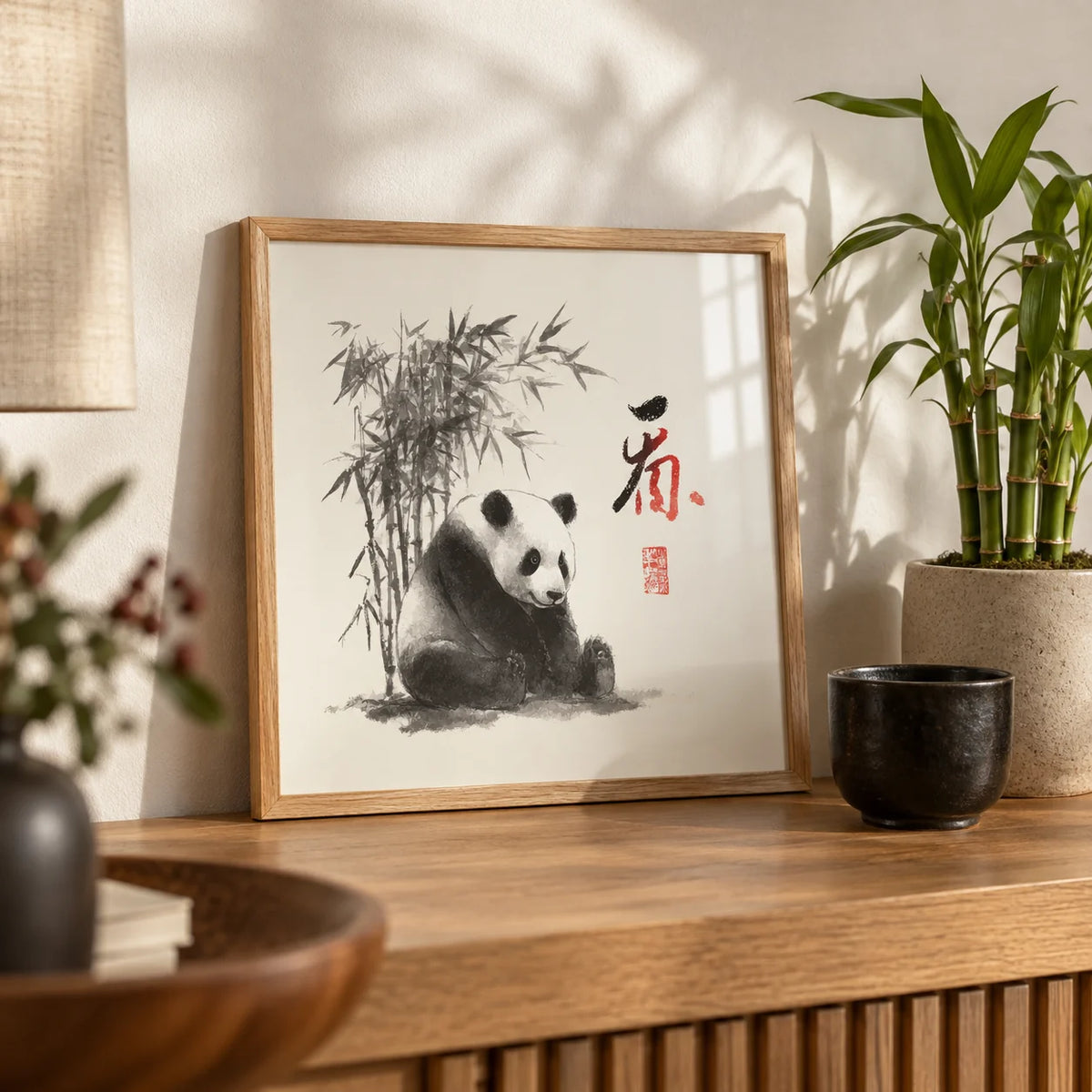 Panda Art Print, a small A4 framed print leaning on an oak shelf in a living room