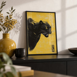 Panther Wall Art, a small A4 framed print leaning on a black shelf in a living room