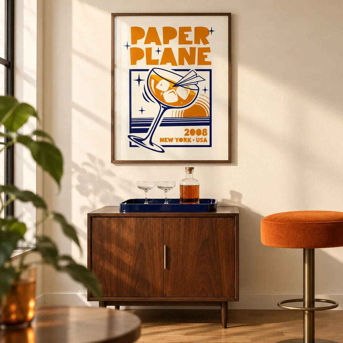 Paper Plane Cocktail Poster, framed on the wall of a retro modern home bar corner in a UK city flat with a warm ivory wall and oak floor in a living room