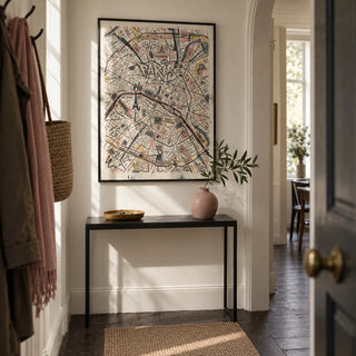 Paris Map Art Print, framed on the wall of a narrow entrance hallway in a London flat with cream walls