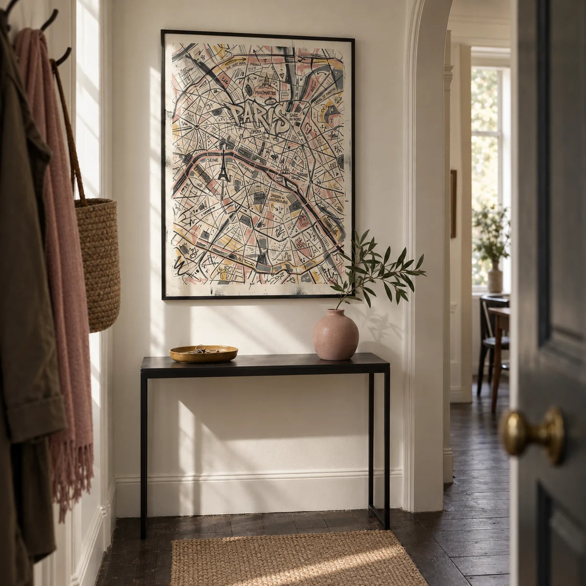 Paris Map Art Print, framed on the wall of a narrow entrance hallway in a London flat with cream walls