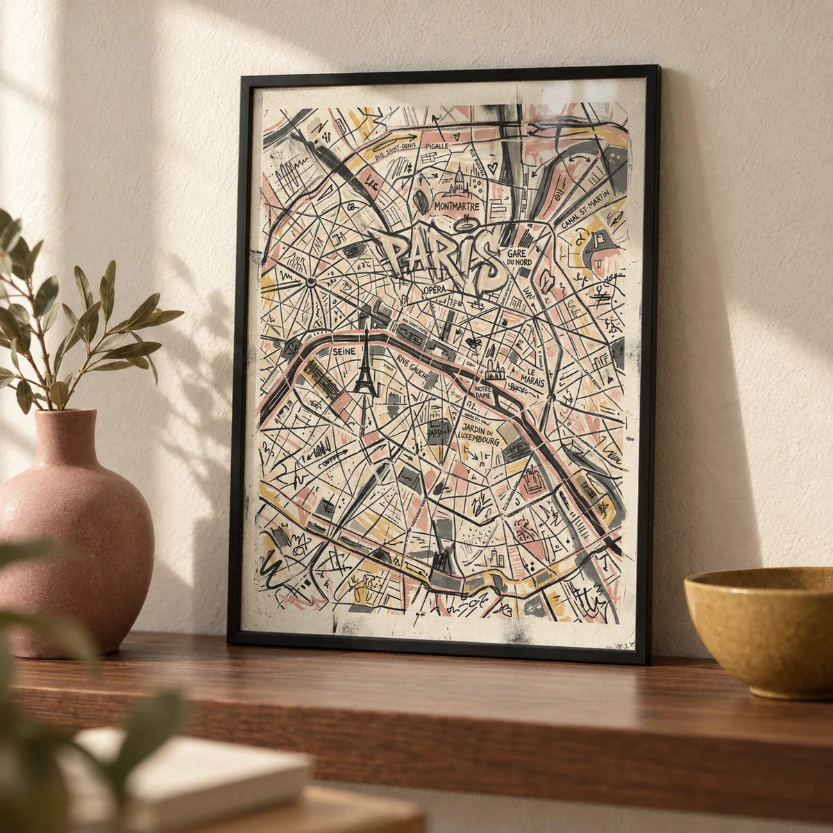Paris Map Art Print, a small A4 framed print leaning on a walnut shelf in a living room