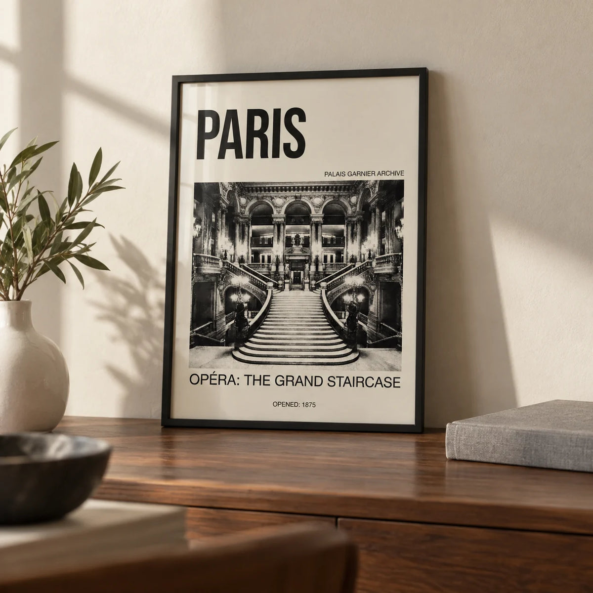 Paris Opera Art Print, a small A4 framed print leaning on a walnut desk