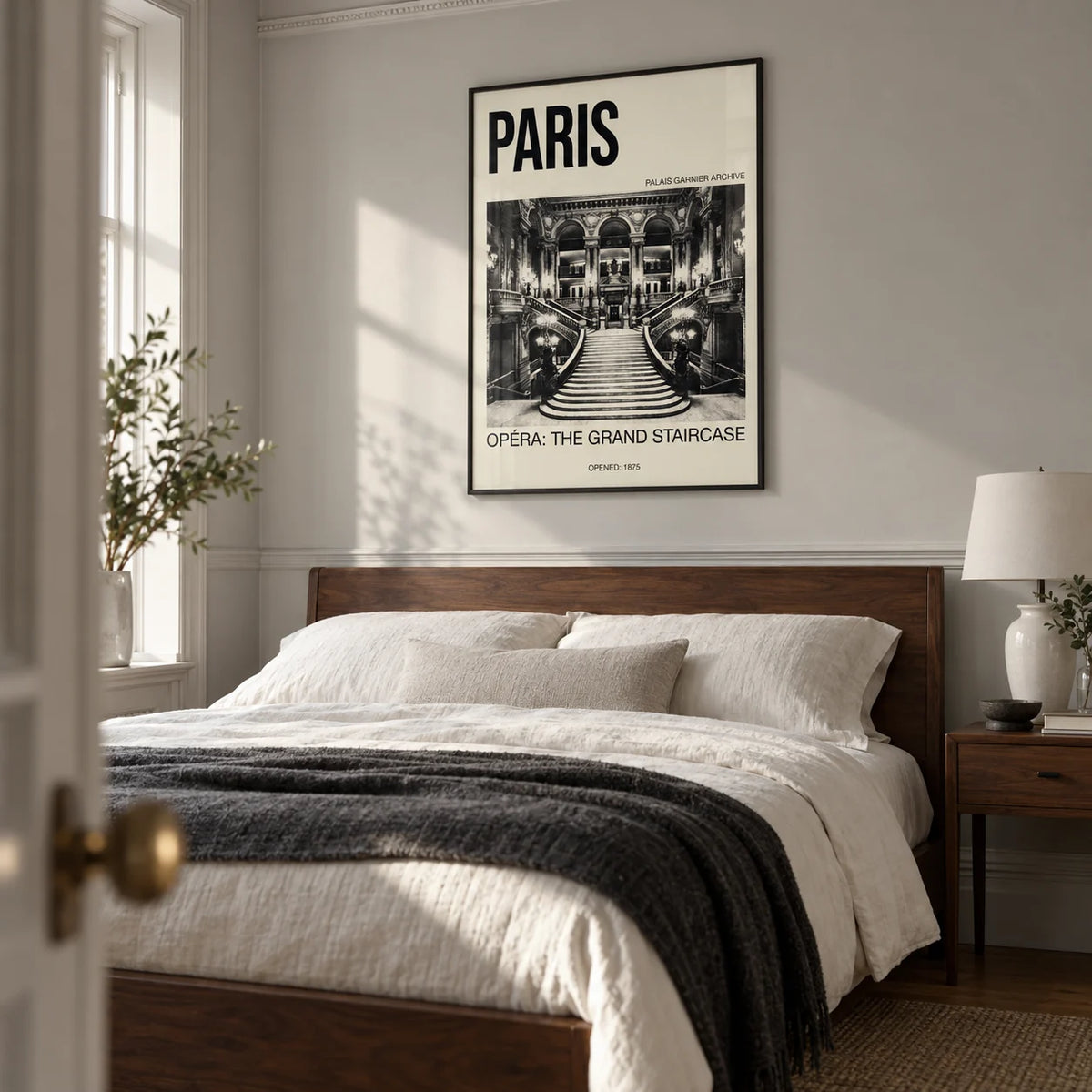 Paris Opera Art Print, framed on the wall of a tailored bedroom in a UK period apartment with a pale grey wall and restrained plaster moulding