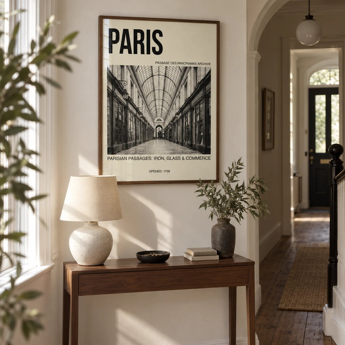 Parisian Passage Art Print, framed on the wall of a narrow entrance hall in a renovated UK terrace with warm white walls and original timber floorboards