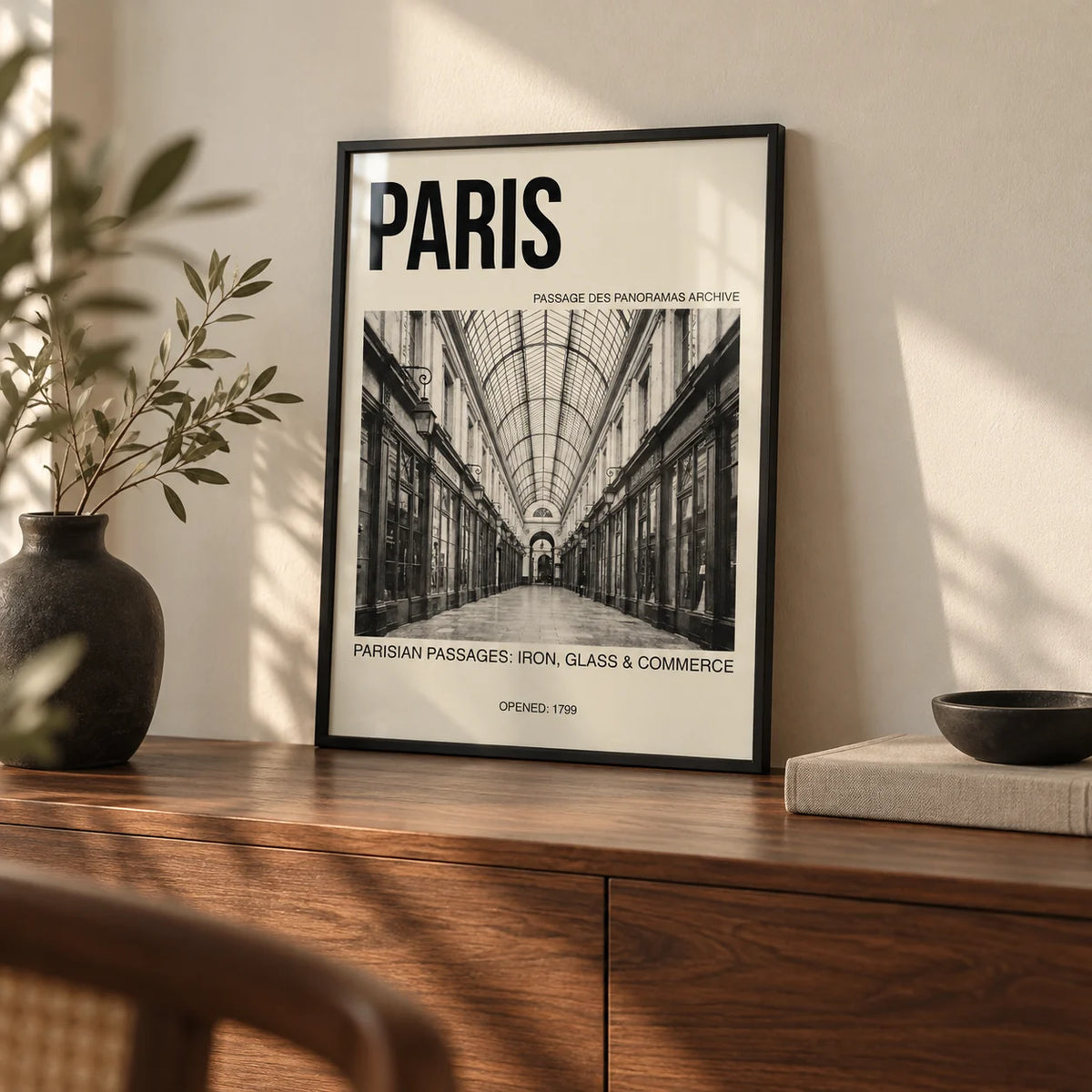 Parisian Passage Art Print, a small A4 framed print leaning on a walnut sideboard in a living room
