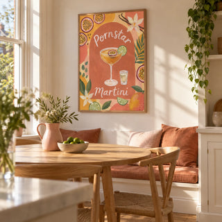 Passion Fruit Martini Poster, framed on the wall of a sunny dining nook in a Victorian terrace with warm white walls and a built-in bench