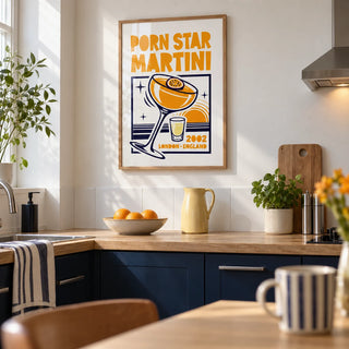Passion Fruit Martini Print, framed on the wall of a modern kitchen in a UK terraced house with plain navy lower cabinets and a white plaster wall