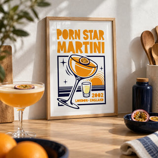 Passion Fruit Martini Print, a small A4 framed print leaning on a pale oak kitchen worktop