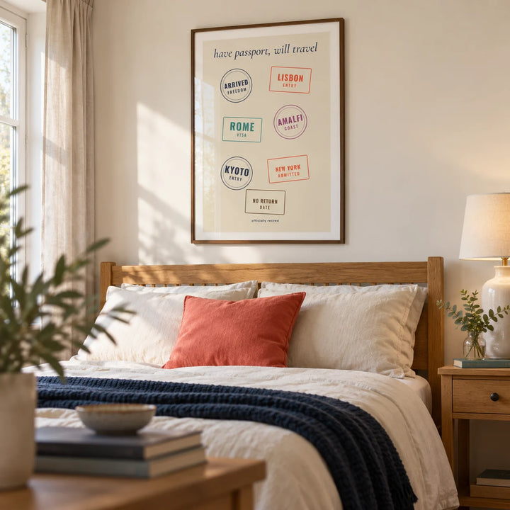 Passport Stamps Poster, framed on the wall of a comfortable main bedroom in a travel-loving retired couple's UK home with warm white walls