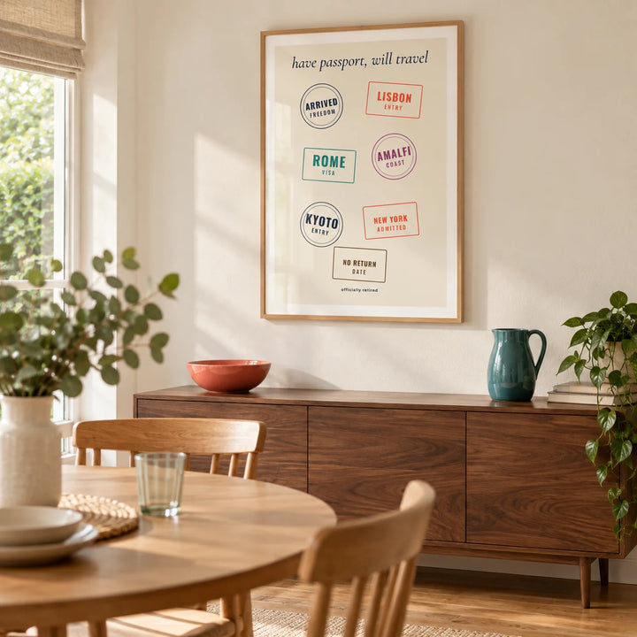 Passport Stamps Poster, framed on the wall of a relaxed modern dining room in a UK bungalow with a pale cream wall and oak floor