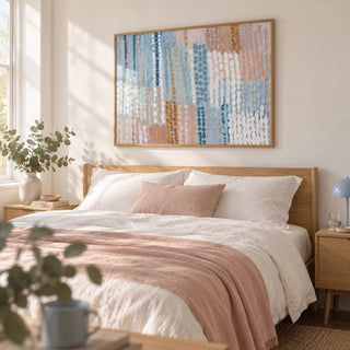 Pastel Blue And Pink Abstract Prints, framed on the wall of a calm bedroom with a soft white wall