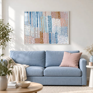 Pastel Blue And Pink Abstract Prints, framed on the wall of a light modern living room with a white wall