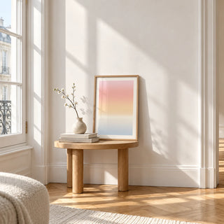 Pastel Pink Print, a small A4 framed print leaning on a small solid oak side table