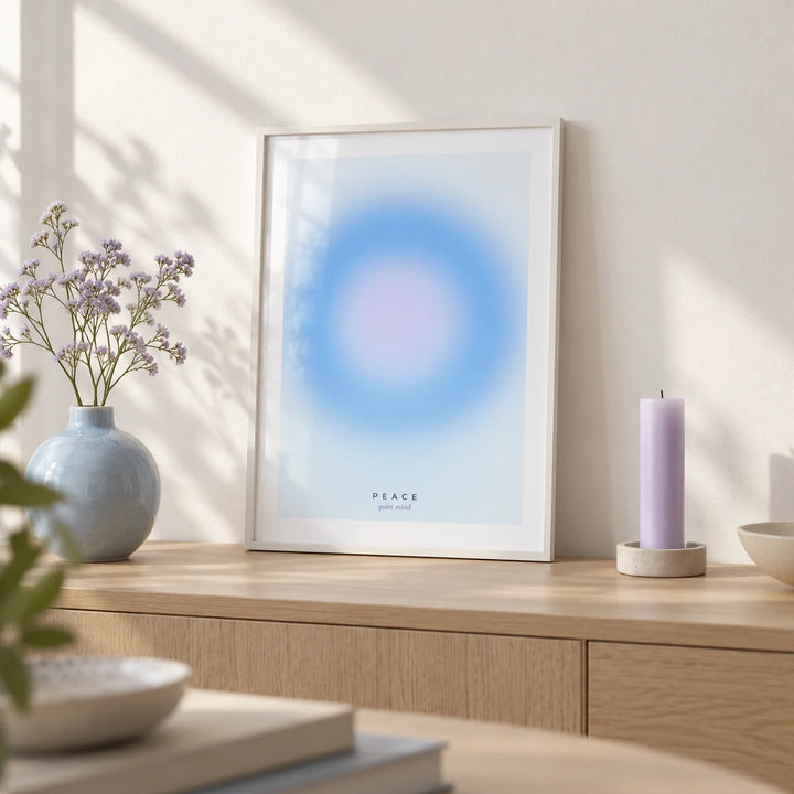 Peace Poster, a small A4 framed print leaning on a pale oak sideboard in a living room