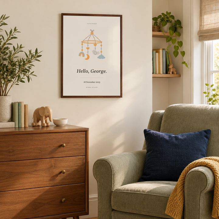 Baby Nursery Poster in a cosy nursery feeding corner, dark wood frame