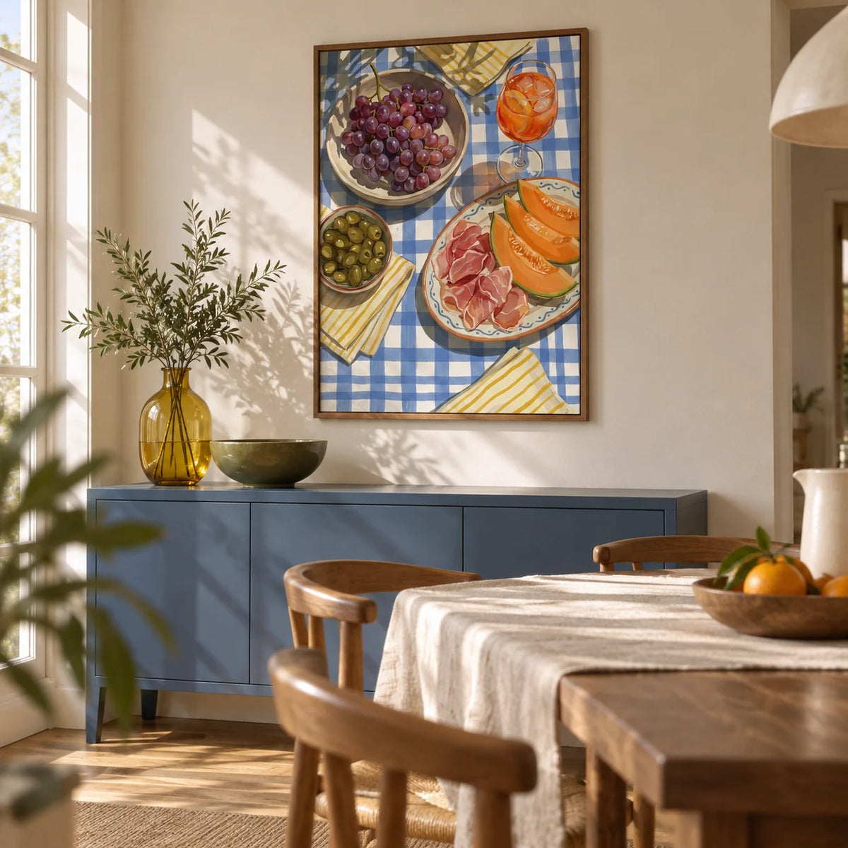 Picnic Decor Wall Art, framed on the wall of a relaxed modern dining room with chalky cream walls and an oak floor