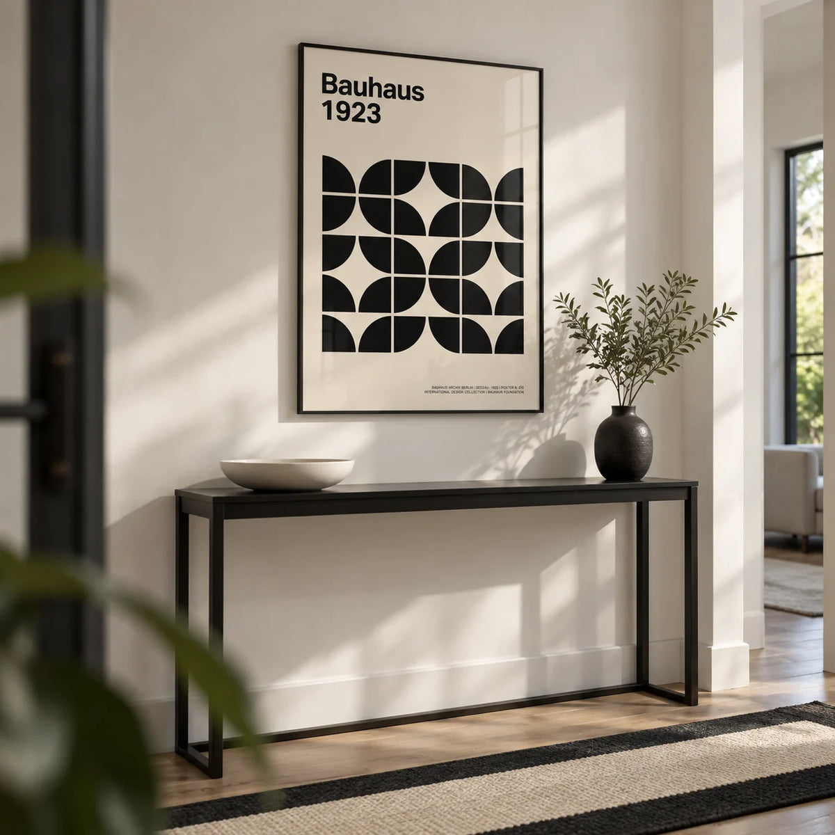 Pictures for Home Office, framed on the wall of a crisp hallway with a white wall and a black and white plain floor runner