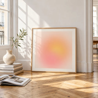 Pink and Yellow Print, framed and leaning on the parquet floor of a bright living room