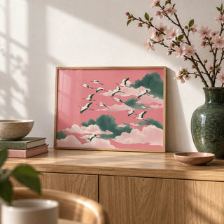 Pink Crane Wall Art, a small A4 framed print leaning on an oak sideboard in a living room