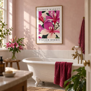 Pink Floral Prints, framed on the wall of a pretty bathroom with a pale pink plaster wall and plain white tiles