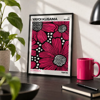 Pink Posters, a small A4 framed print leaning on a black desk