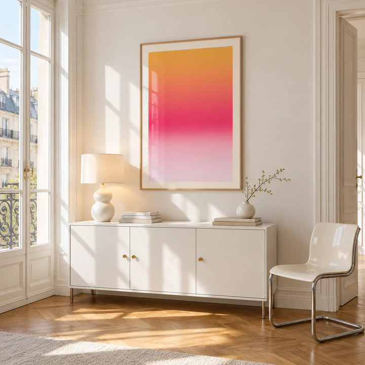 Pink Sunset Wall Art, framed on the wall of a bright Paris style apartment in a living room