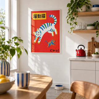 Playful Cat Art Print, framed on the wall of a crisp white modern kitchen