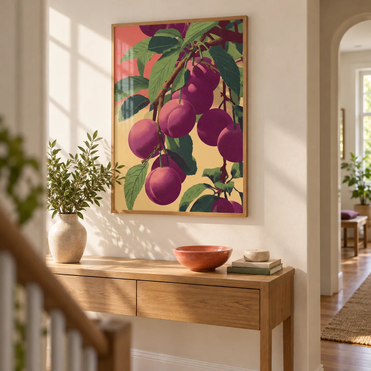 Plum Poster, framed on the wall of a bright hallway with a warm white wall