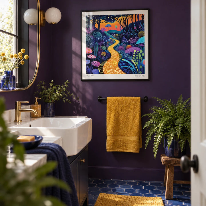 Polka Dot Pop Art, framed on the wall of a bold modern bathroom with a deep purple painted wall and a white basin