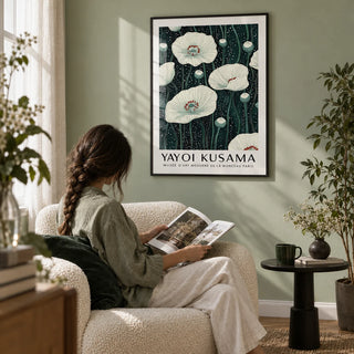 Poppy Prints, framed on the wall of a reading nook with a pale sage wall in a living room