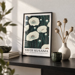 Poppy Prints, a small A4 framed print leaning on a black shelf in a living room