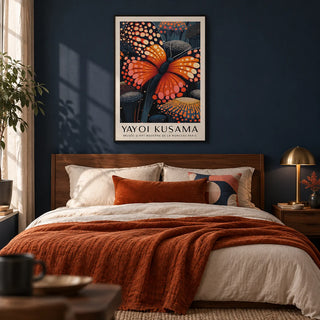 Poster Butterfly, framed on the wall of a moody bedroom with a deep navy painted wall