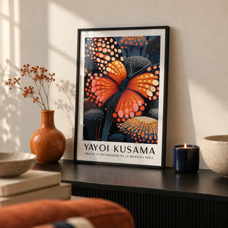 Poster Butterfly, a small A4 framed print leaning on a black shelf in a living room