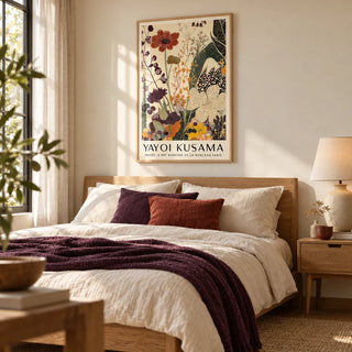 Poster Yayoi Kusama, framed on the wall of a calm bedroom with a warm cream wall