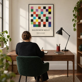 Posters for Office, framed on the wall of a crisp home office in a design-led UK flat with a warm white wall and walnut floor