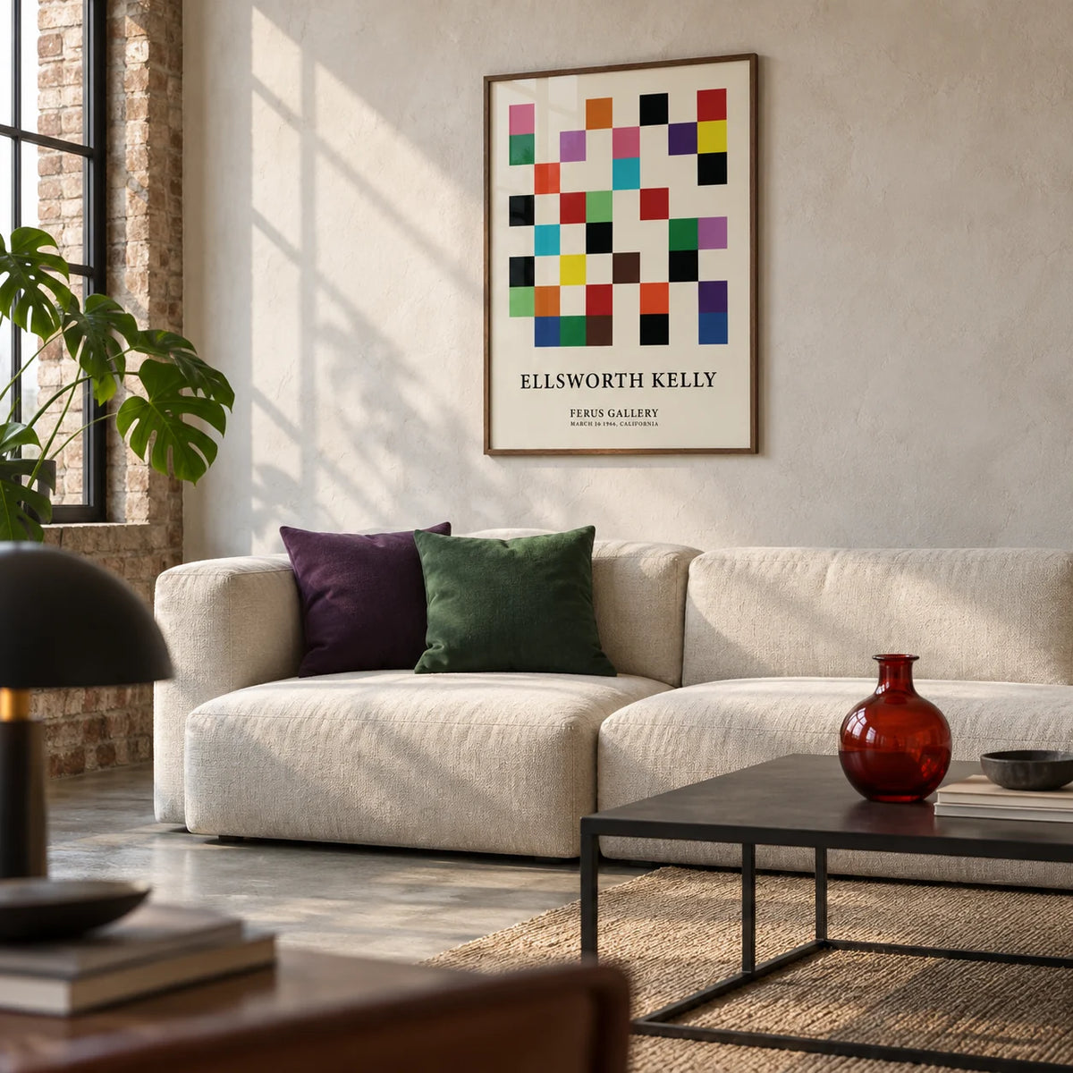 Posters for Office, framed on the wall of a modern living room in a converted UK warehouse flat with a pale plaster wall and a concrete floor