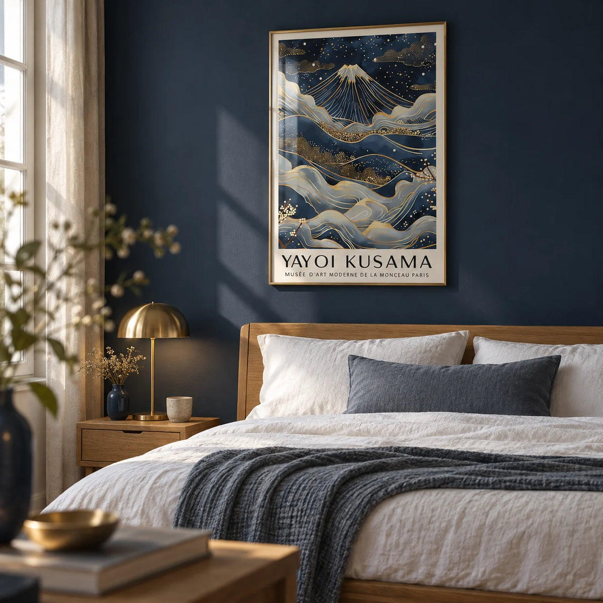 Posters from Japan, framed on the wall of a calm bedroom with a deep navy painted wall