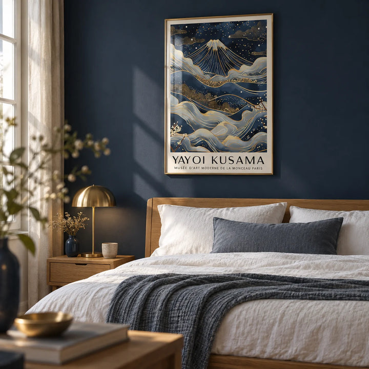 Posters from Japan, framed on the wall of a calm bedroom with a deep navy painted wall