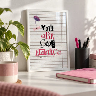 Posters of Positivity, a small A4 framed print leaning on a white desk