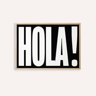 Framed print close-up of bold HOLA typography in black and white