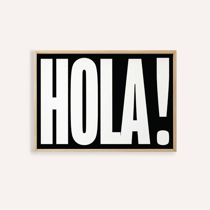 Framed print close-up of bold HOLA typography in black and white