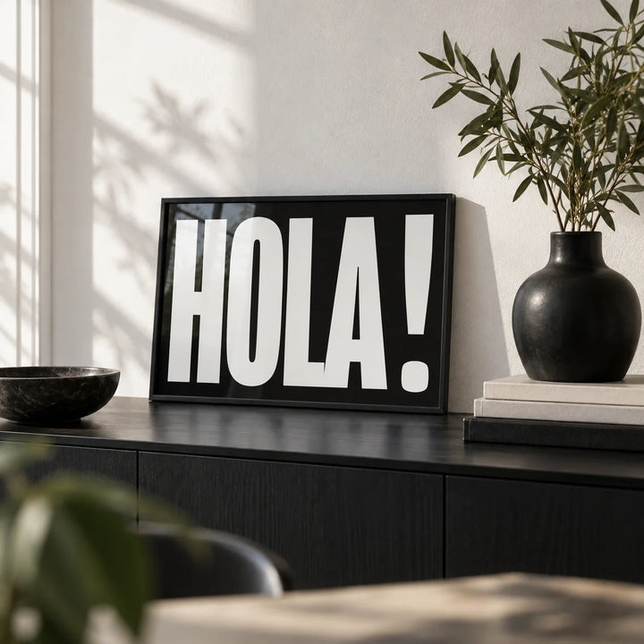 Posters with Typography, a small A4 framed print leaning on a black sideboard in a living room