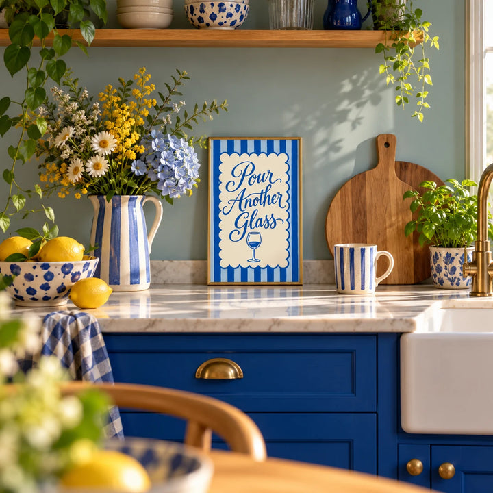 Pour Another Glass Print, a small A4 framed print leaning on a kitchen worktop