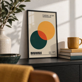 Print Geometric, a small A4 framed print leaning on a black shelf in a living room