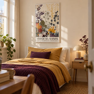 Print Yayoi Kusama, framed on the wall of a calm single bedroom in a first flat (22-28) with a warm cream wall