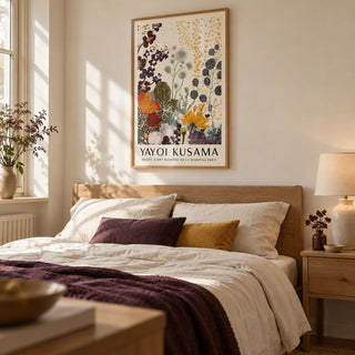 Print Yayoi Kusama, framed on the wall of a soft cream bedroom